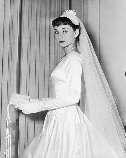Audrey Hepburn wears her wedding gown, designed by Zoe Fontana​. ​