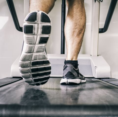 Austria, Klagenfurt, man running on treadmill