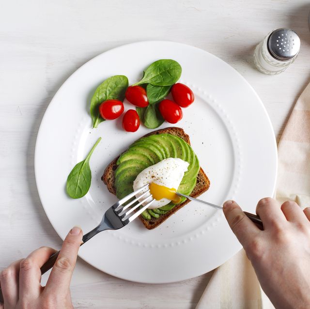 avocado sandwich with poached egg sliced avocado and egg on toasted bread for healthy breakfast