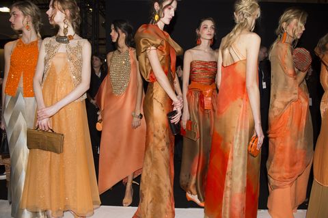 Hairstyle, Orange, Fashion, Dress, Fashion model, One-piece garment, Gown, Model, Peach, Costume design, 