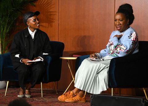 janicza bravo and tarana burke sitting on stage at the meteor and gucci's chime for change global gender equity summit