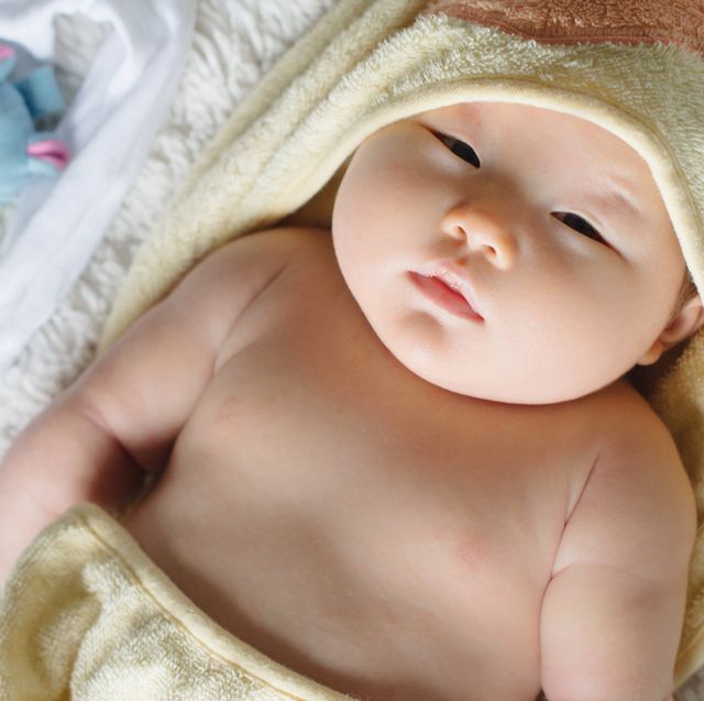 newborn baby in hooded bath towel