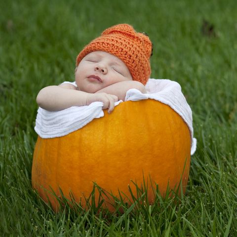 baby in pumpkin