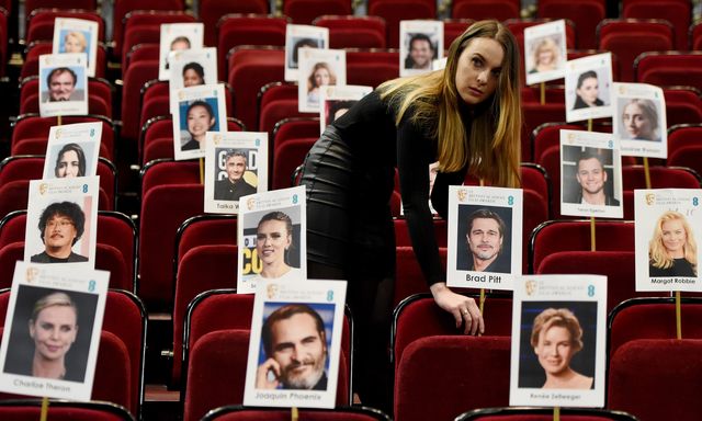 london, england   january 30 staff lay out heads on sticks as they arrange seat placings during the ee british academy film awards 2020 'heads on sticks' photocall at royal albert hall on january 30, 2020 in london, england photo by kate greengetty images