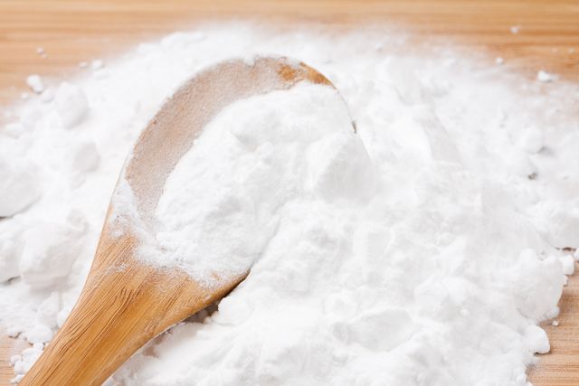 baking soda with wooden spoon