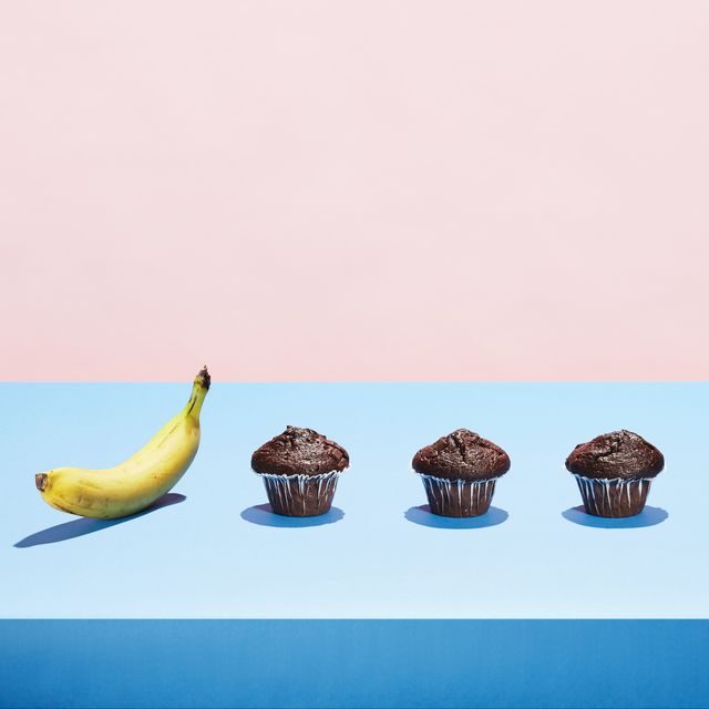a banana in a row of chocolate cupcakes