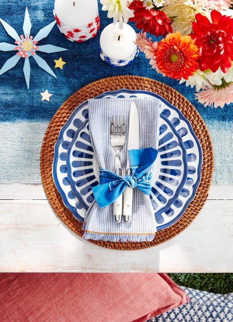 strips of torn bandana make for homespun ties on fringed, striped napkins $8 each potterybarncom atop painterly melamine pg 38 and a woven charger $18 potterybarncom