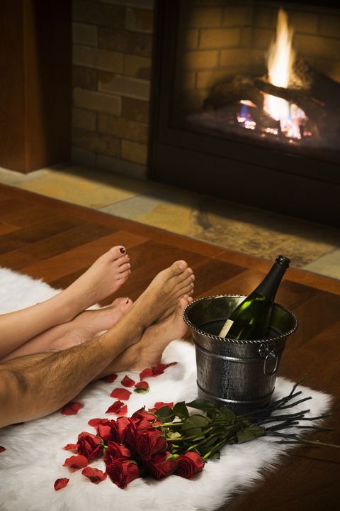 Bare Legs with Valentine Roses, Champagne and Fireplace, Copy Space
