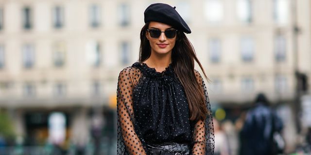 paris, france   september 26 gabrielle caunesil wears a black beret, sunglasses, a frilly collar, a black mesh lace top with printed polka dots, a balck leather skirt with belts, a bag,  outside redemption, during paris fashion week   womenswear spring summer 2020 on september 26, 2019 in paris, france photo by edward berthelotgetty images
