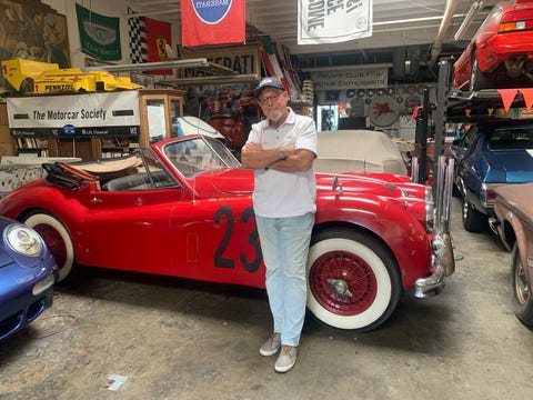 barnaby brokaw pictured with denise mccluggage's jaguar xk140