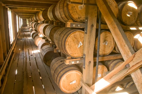 whiskey barrels in a rickhouse