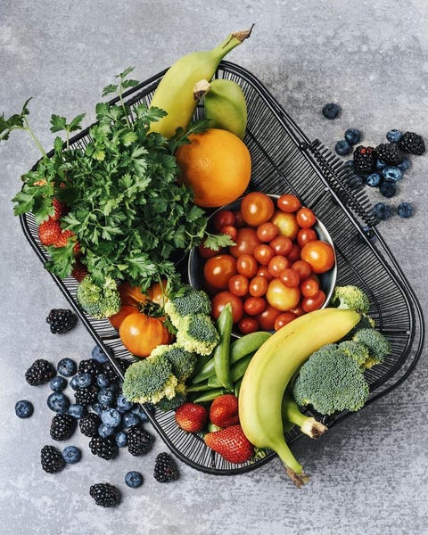 A basket of fresh vegetables, and fruits