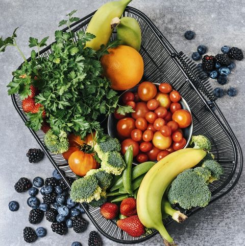 A basket of fresh vegetables, and fruits