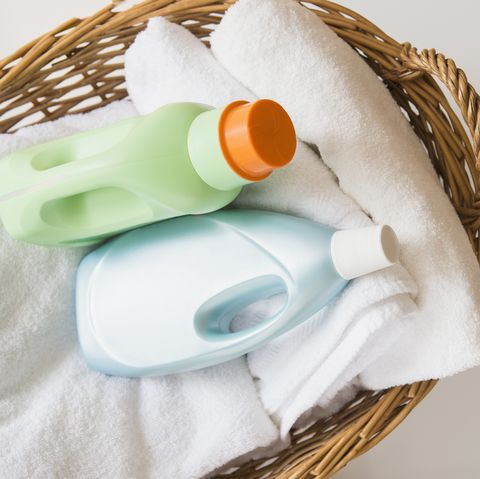 basket with laundry and detergents