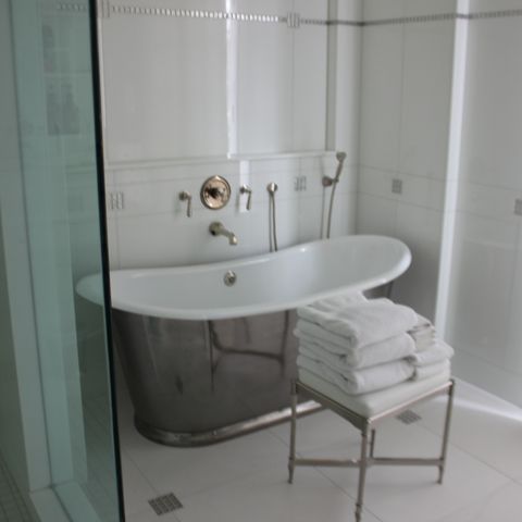 bathroom with silver tub