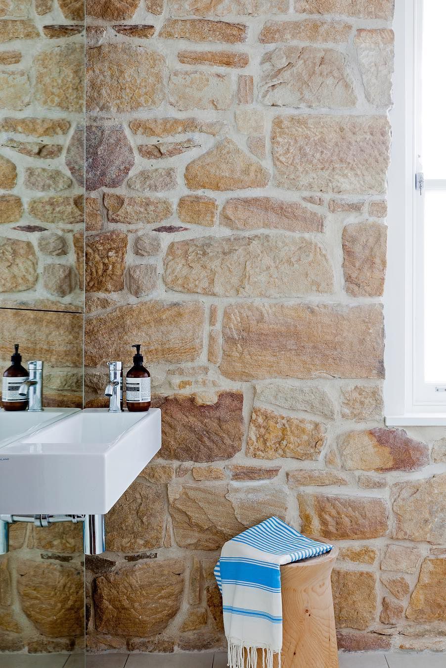 small bathroom with brick wall