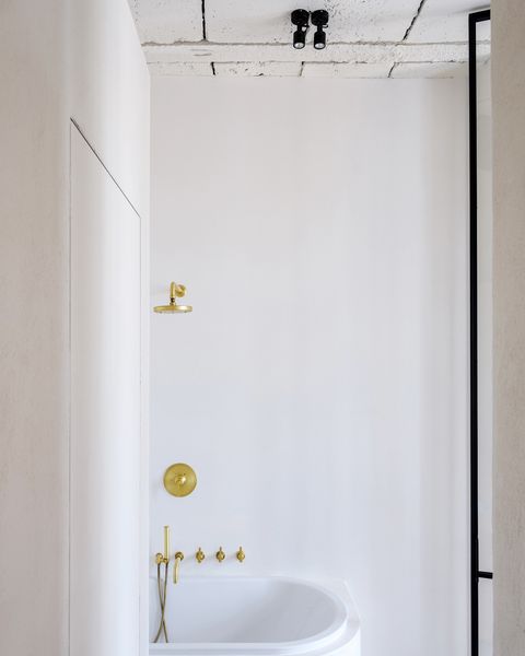 modern white bathroom without shower enclosure
