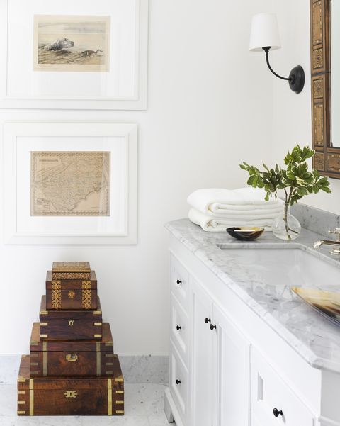 you cannot go wrong with a classic marble countertop and plenty of storage in drawers in a simple yet spacious vanity underneath