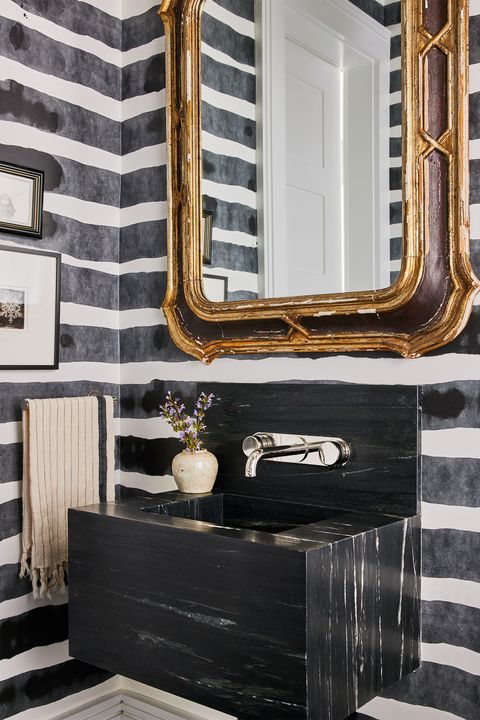 small powder room with black and white wallpaper