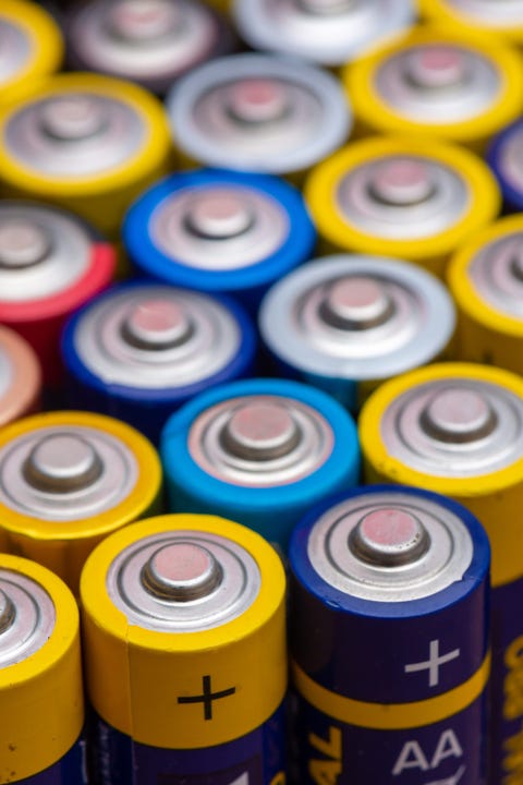 Many used AA electric batteries many used aa electric batteries, lined up upright and viewed from above concepts of energy waste and battery recycling