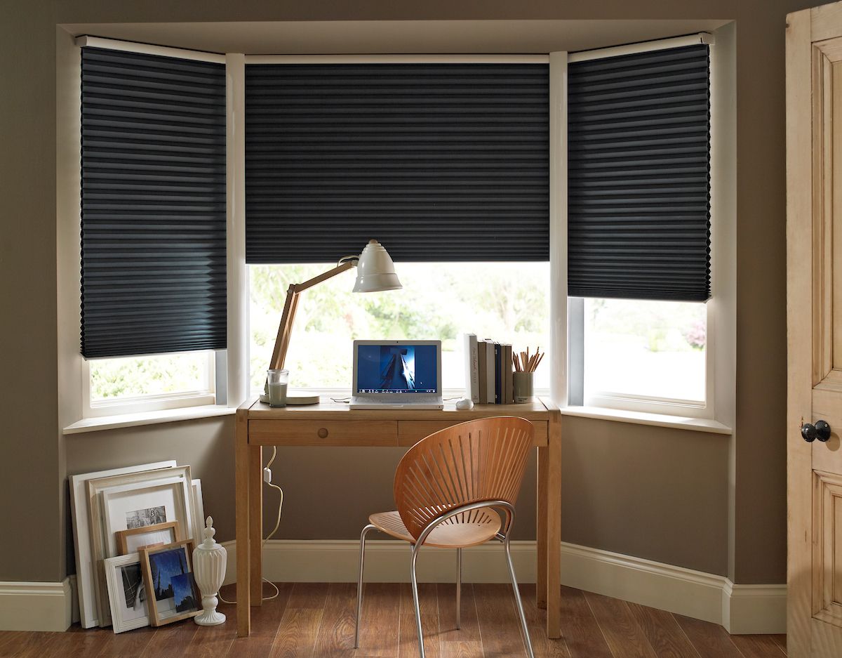 desk in front of bay window