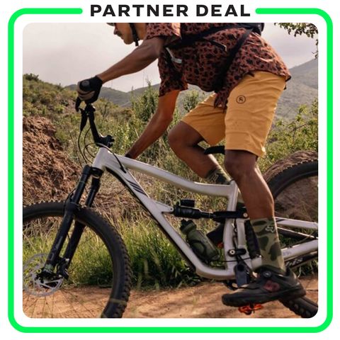 partner deal man riding bicycle wearing backcountry gear
