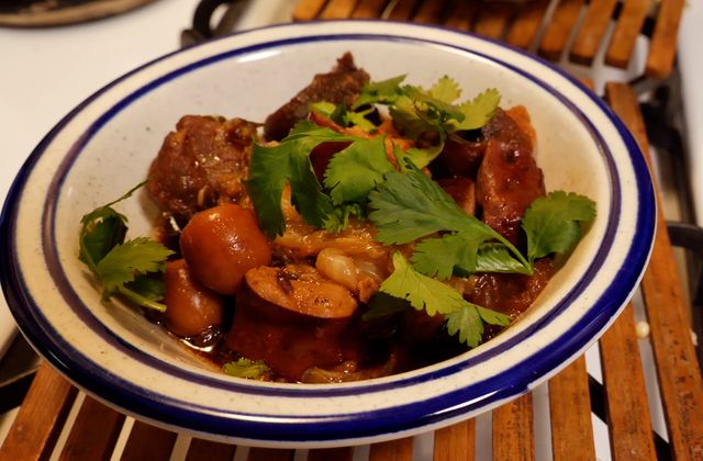 instant pot braised pork is topped with cilantro