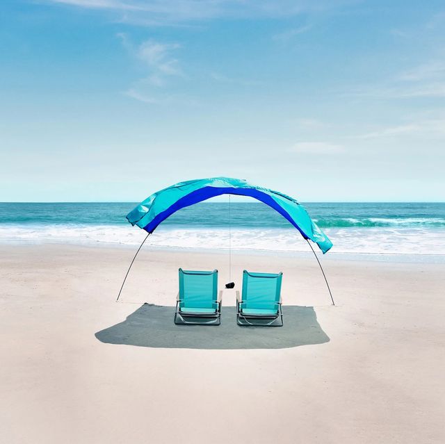 two chairs under a shibumi shade tent on a beach