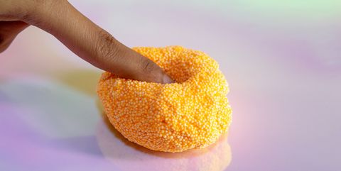 beads slime with human hand