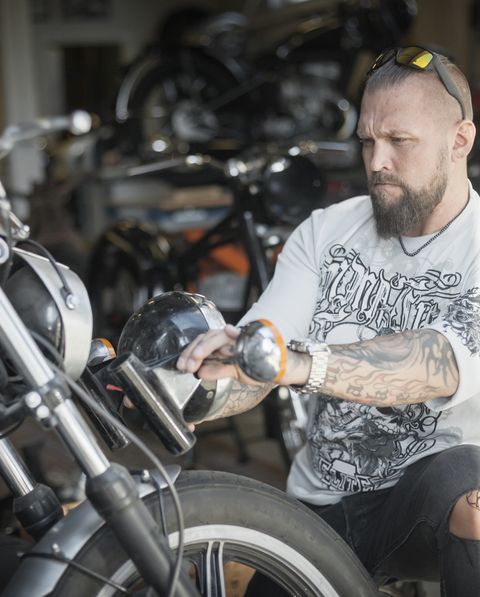 bearded man with custom motorcycle