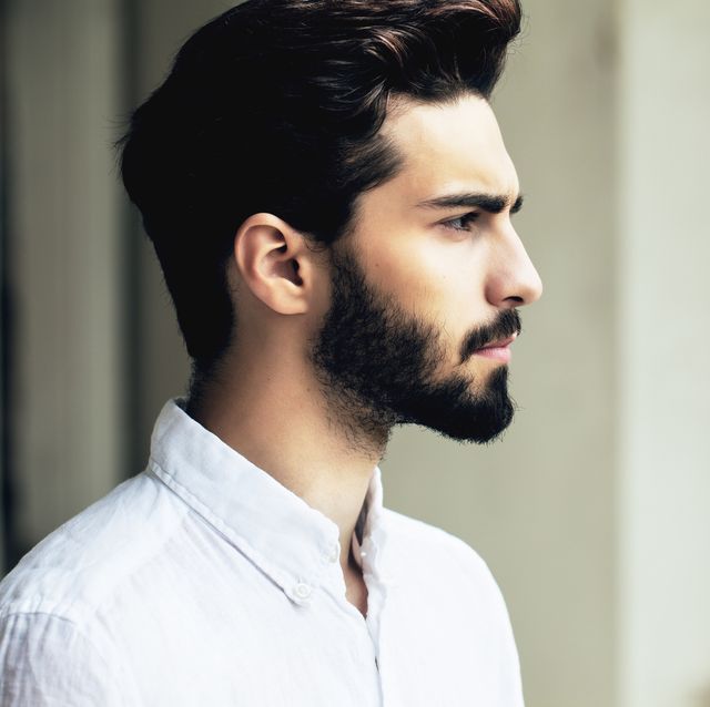 bearded stylish man posing outdoors