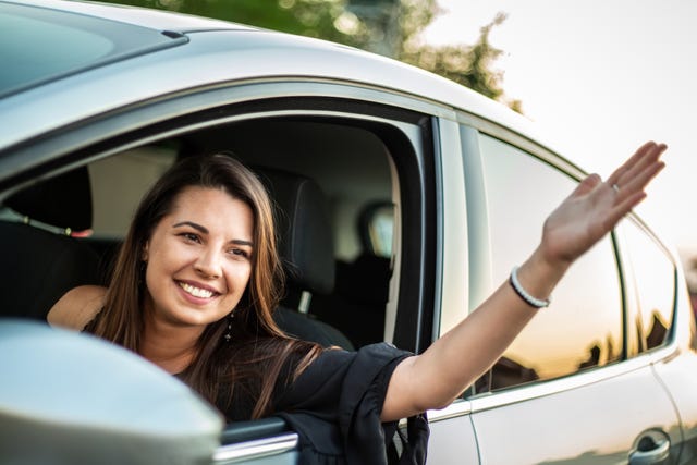 beautiful smiling girl in the car