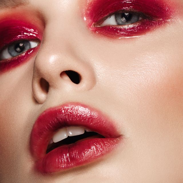 beautiful woman with glossy red bright makeup