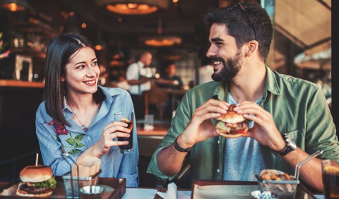 beautiful young couple sitting in a cafe, having breakfast love, dating, food, lifestyle concept