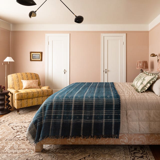 bedroom-colors-heidi-caillier-design-seattle-interior-designer-pink-walls-master-bedroom-yellow-printed-chair-blue-blanket-bed-british-layered-print-mixing-n28-tudor-vintage-rug-sconces-tapered-lampshade-1576613640.jpg