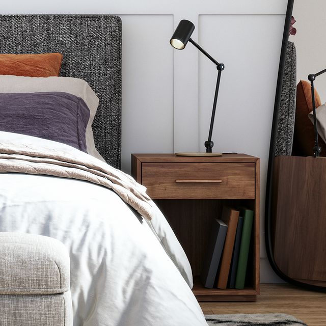 contemporary bedroom with wooden nightstand next to bed