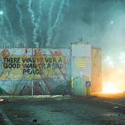 Loyalist Protest Turns Violent At Belfast Peace Line belfast, northern ireland april 07 nationalists and loyalists riot against one another at the peace wall interface gates which divide the two communities on april 7, 2021 in belfast, northern ireland violence broke out after a loyalist protest took place in front of the gates of the peace line at the springfield road lanark way interface youths attacked police officers and petrol bombed a bus photo by charles mcquillangetty images