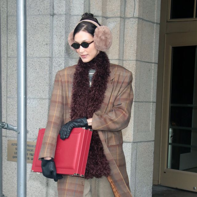 bella hadid wears a winter outfit with earmuffs to illustrate a guide to the best earmuffs for women 2022
