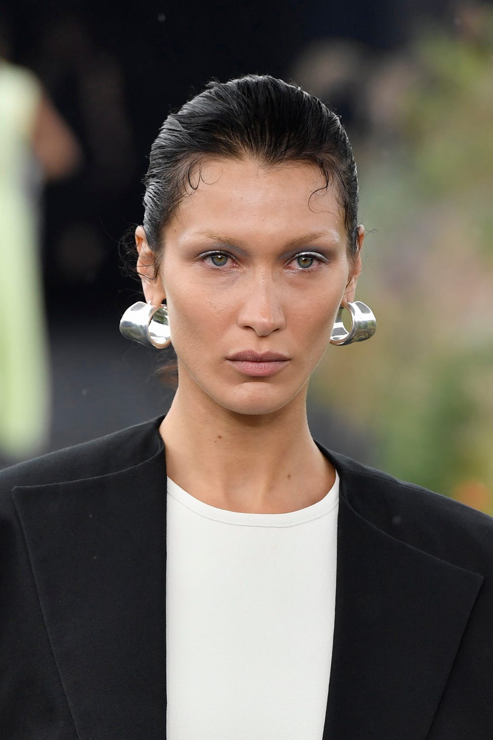 woman wearing silver hoops