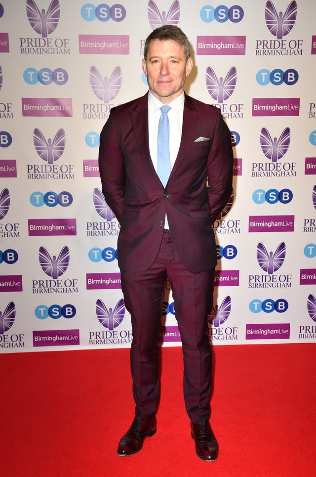 ben shephard arriving at the pride of birmingham awards 2022 wearing a deep purple suit and pale blue tie