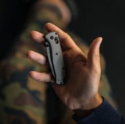 benchmade custom bugout a hand holding a folding pocket knife