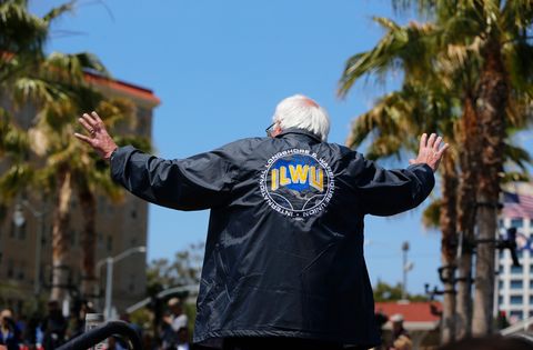 a white man facing away from the camera, wearing an ilwu jacket