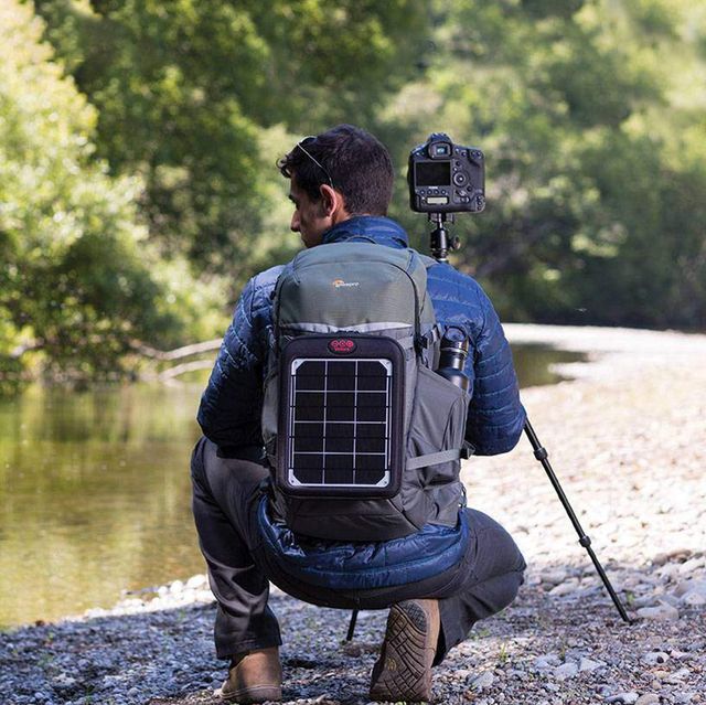 man photographing river with the flipside trek bp 350 aw
