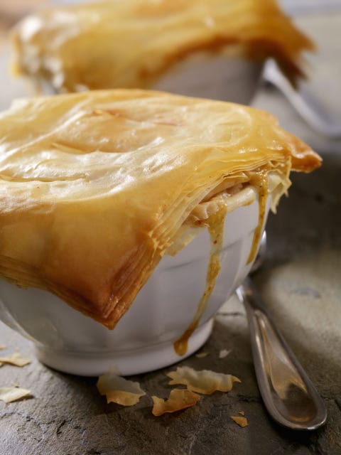 turkey pot pie with phyllo crust in individual bowls with spoons