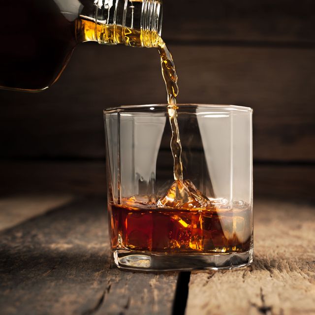 bourbon pouring into glass