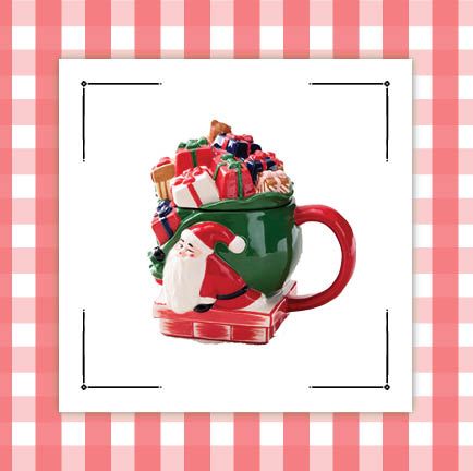 a santa mug with lid and a snow scene mug