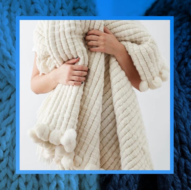a tan and gray chunky knit blanket with a baby blue color overlay and an image of someone wrapping a chunky blanket around their shoulders