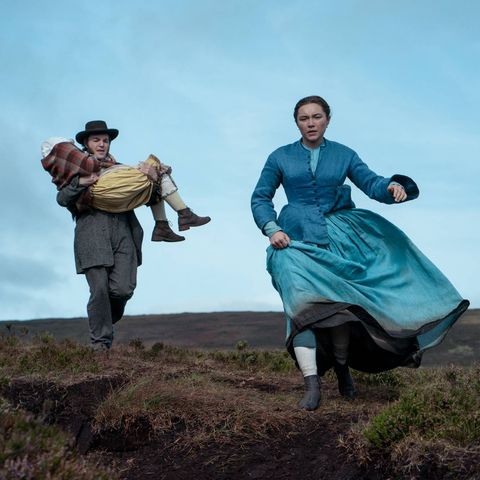 lib leads anna and tom across a field in a scene from the wonder, a good housekeeping pick for best irish movies on netflix
