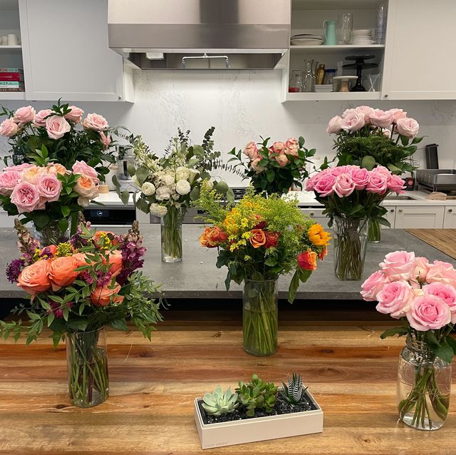 multiple sets of flowers in kitchen to show flower testing at good housekeeping