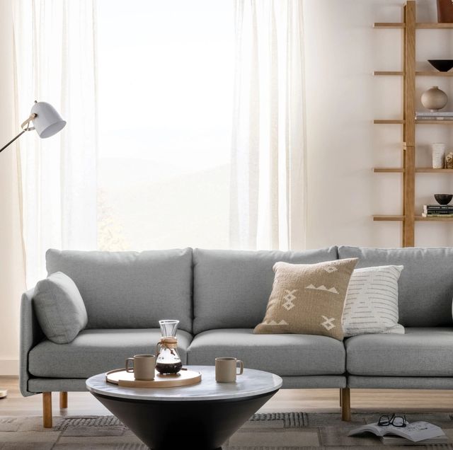 a grey couch in a living room